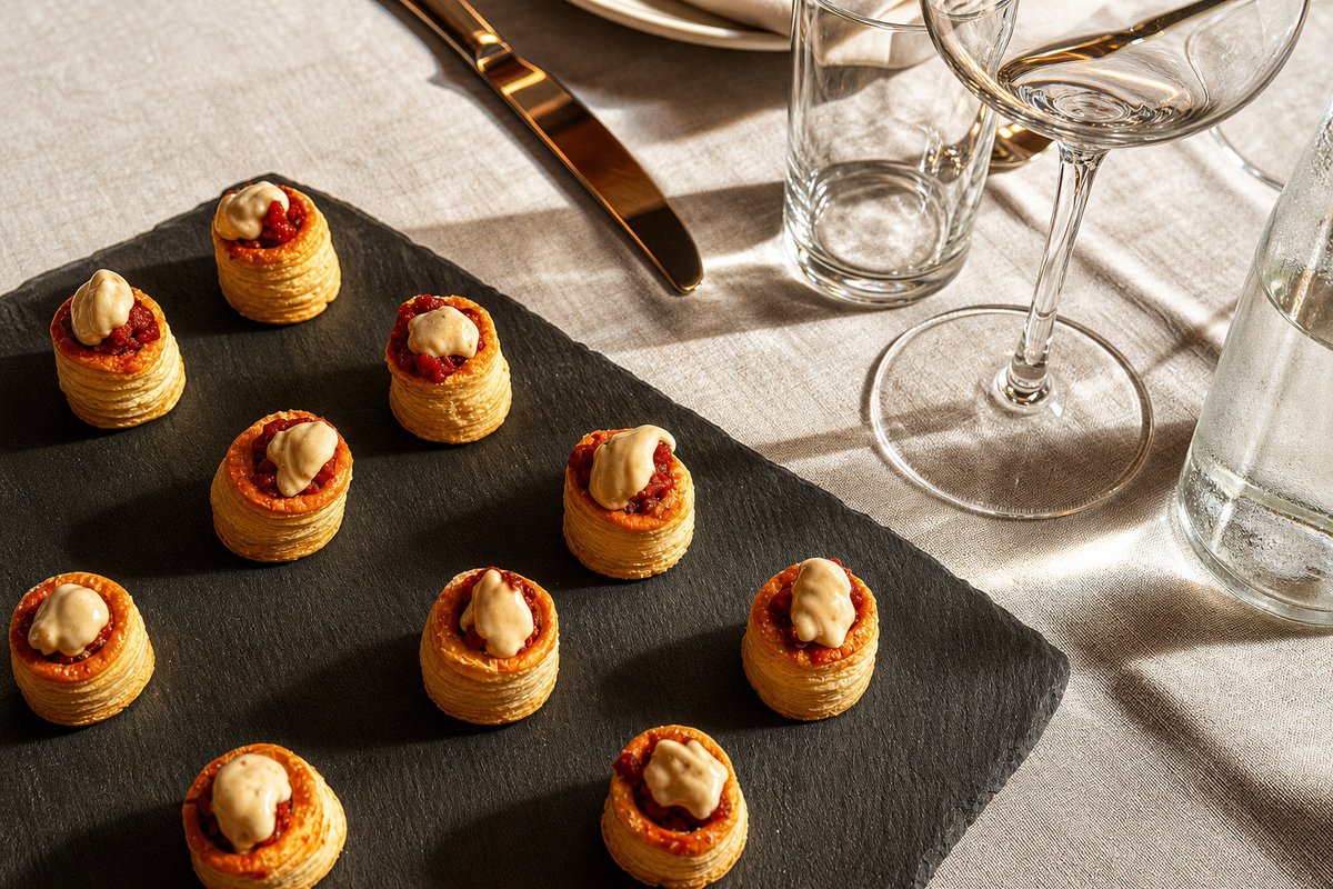 Comparti flaky puff pastry bites paired with wine