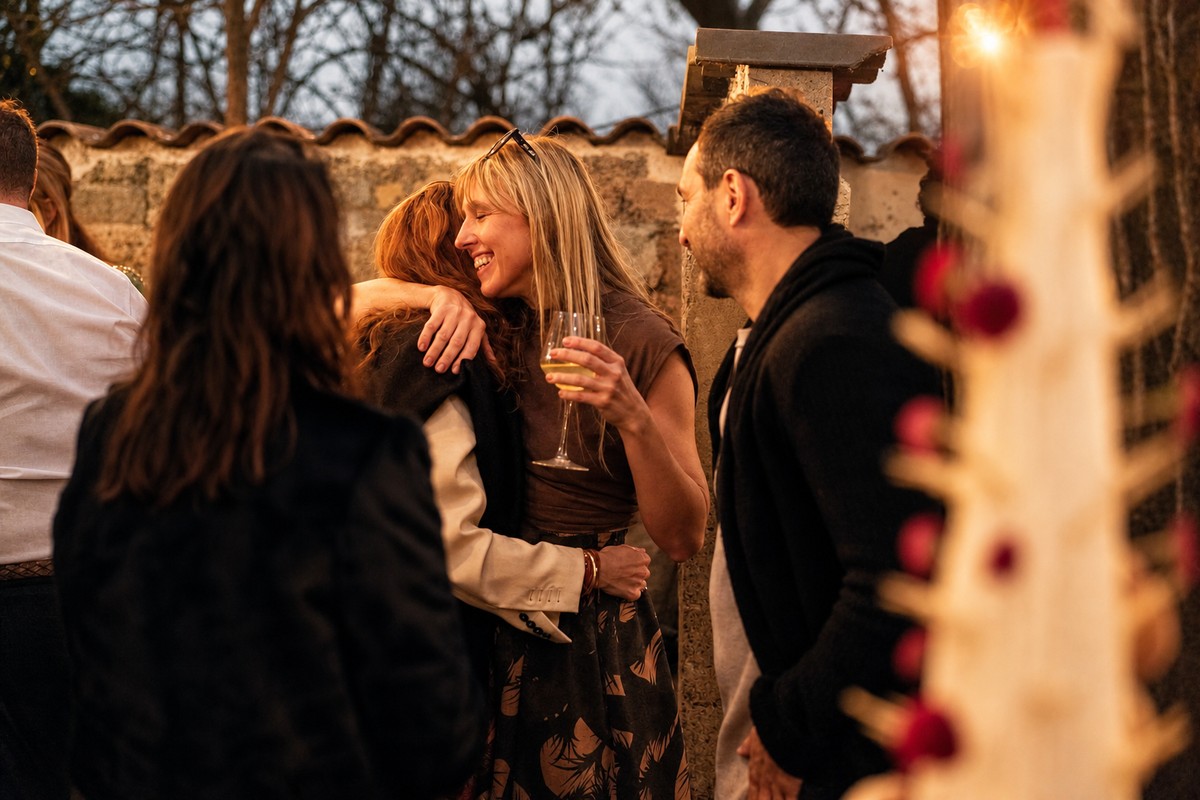 Comparti event friends hugging at sunset