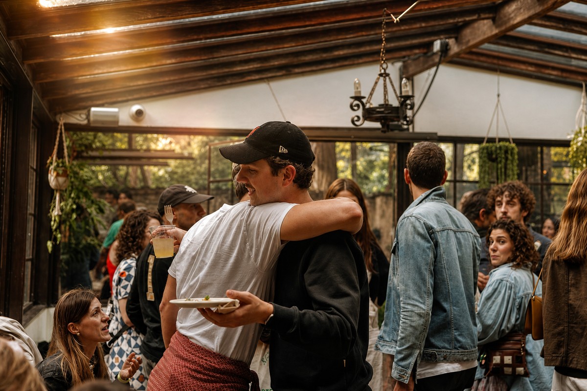 Comparti Brooklyn patio party catering with guests hugging
